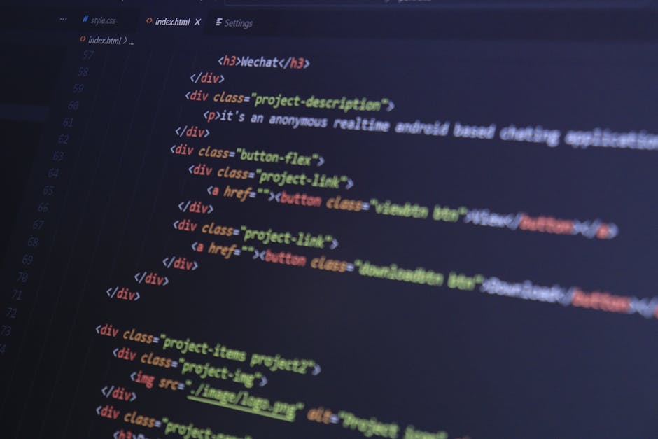 Close-up of HTML code with syntax highlighting on a computer monitor.